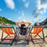 woman with hat sitting chairs beach beautiful tropical beach woman relaxing tropical beach koh nangyuan island scaled 1