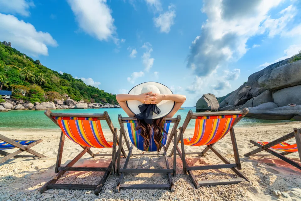 woman with hat sitting chairs beach beautiful tropical beach woman relaxing tropical beach koh nangyuan island scaled 1